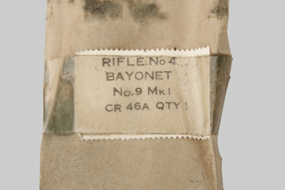 Image of British No. 9 Mk. I bayonet in wrapper with mineral oil preservative