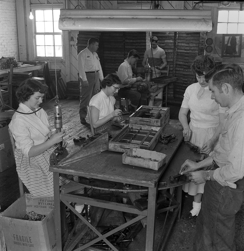 Image of bayonet grip assembly operations at Turner Manufacturing Co. ca. 1955.
