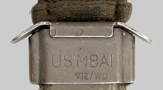 M8A1 scabbard throatpiece showing the apparent addition of WD to an existing VIZ manufacturer symbol.