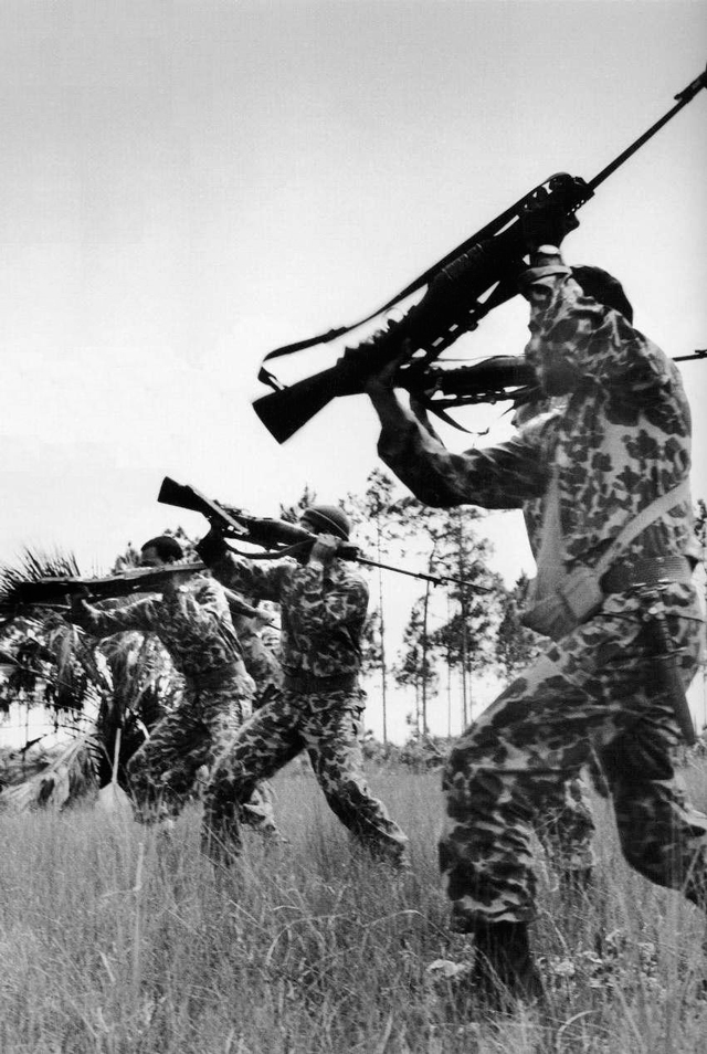 Image of Cuban-Exile guerillas training for the Bay of Pigs invasion, armed with Johnson Model 1941 rifles